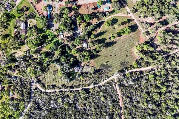 a view of a field with a mountain in the background