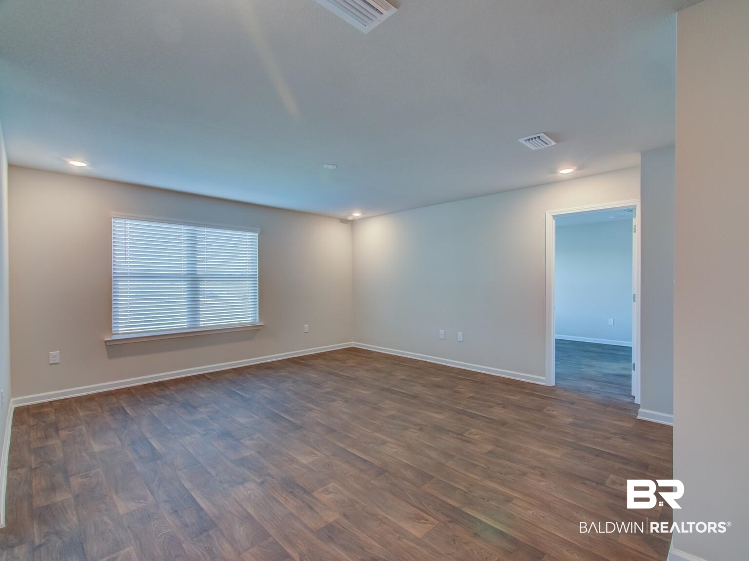 23952 Citation Loop Daphne, AL 36526 - Photo 8 of 69 Spare room with dark wood-type flooring and recessed lighting
