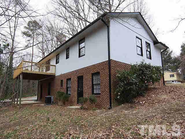 4400 Stonewall Drive Raleigh, NC 27604 - Photo 8 of 8 a view of a house with a yard