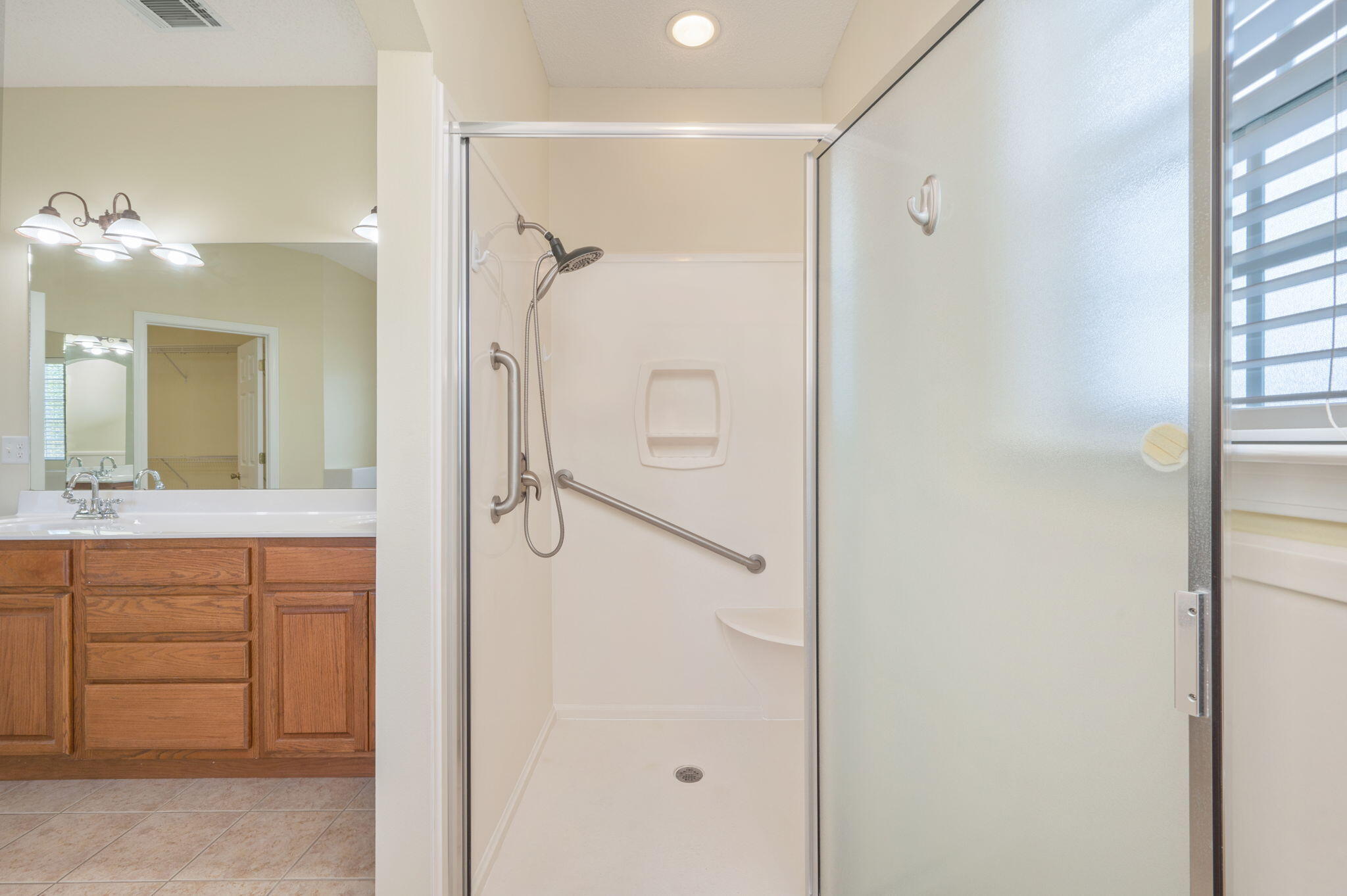 5552 Frontier Drive Crestview, FL 32536 - Photo 27 of 50 a bathroom with a shower sink and mirror