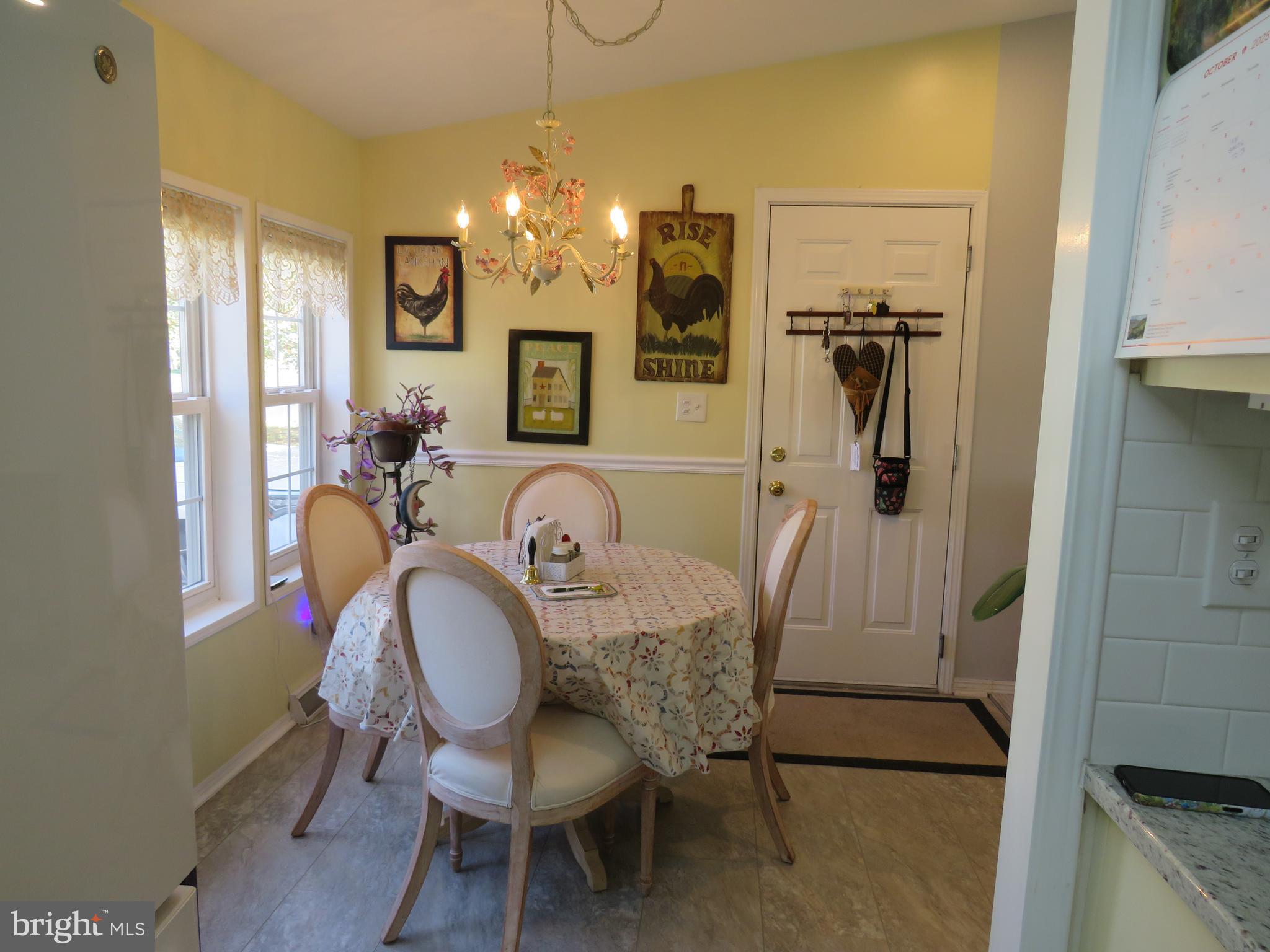 183 Spring Meadow Circle New Hope, PA 18938 - Photo 12 of 37 a view of a dining room with furniture and chandelier