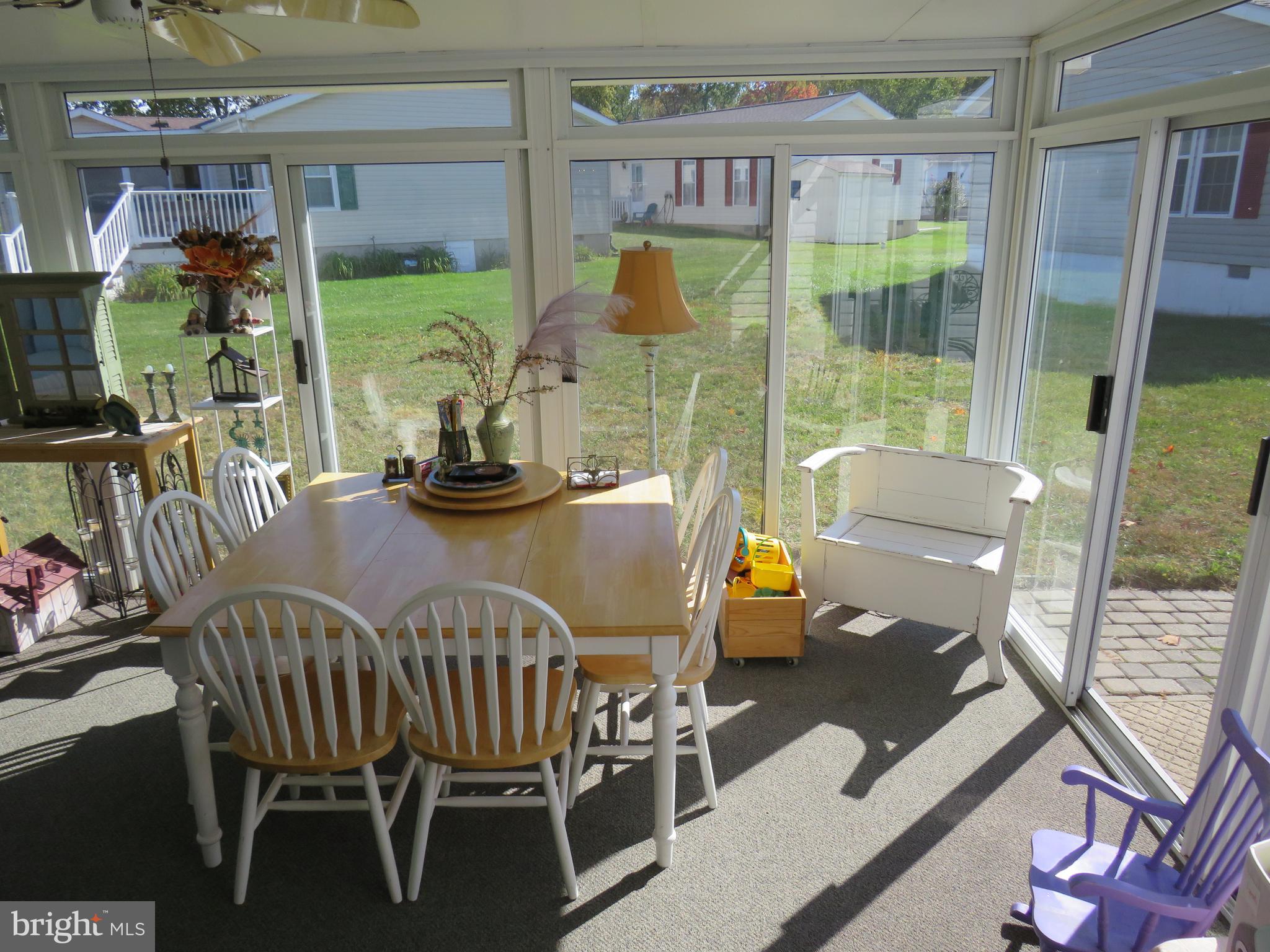 183 Spring Meadow Circle New Hope, PA 18938 - Photo 16 of 37 a view of a dining room with furniture window and outside view