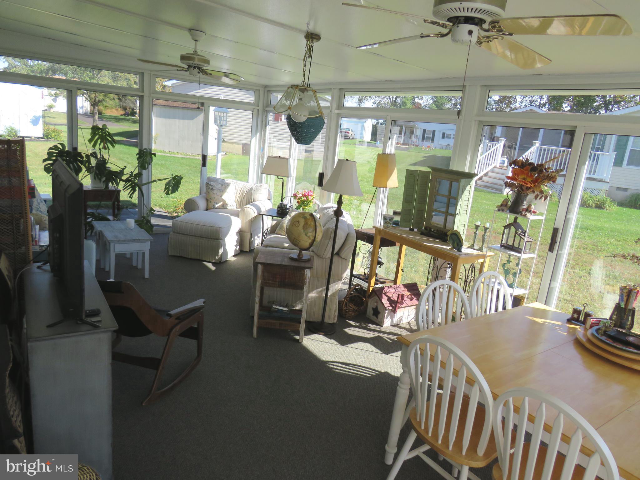 183 Spring Meadow Circle New Hope, PA 18938 - Photo 17 of 37 a view of a dining room with furniture window and outside view