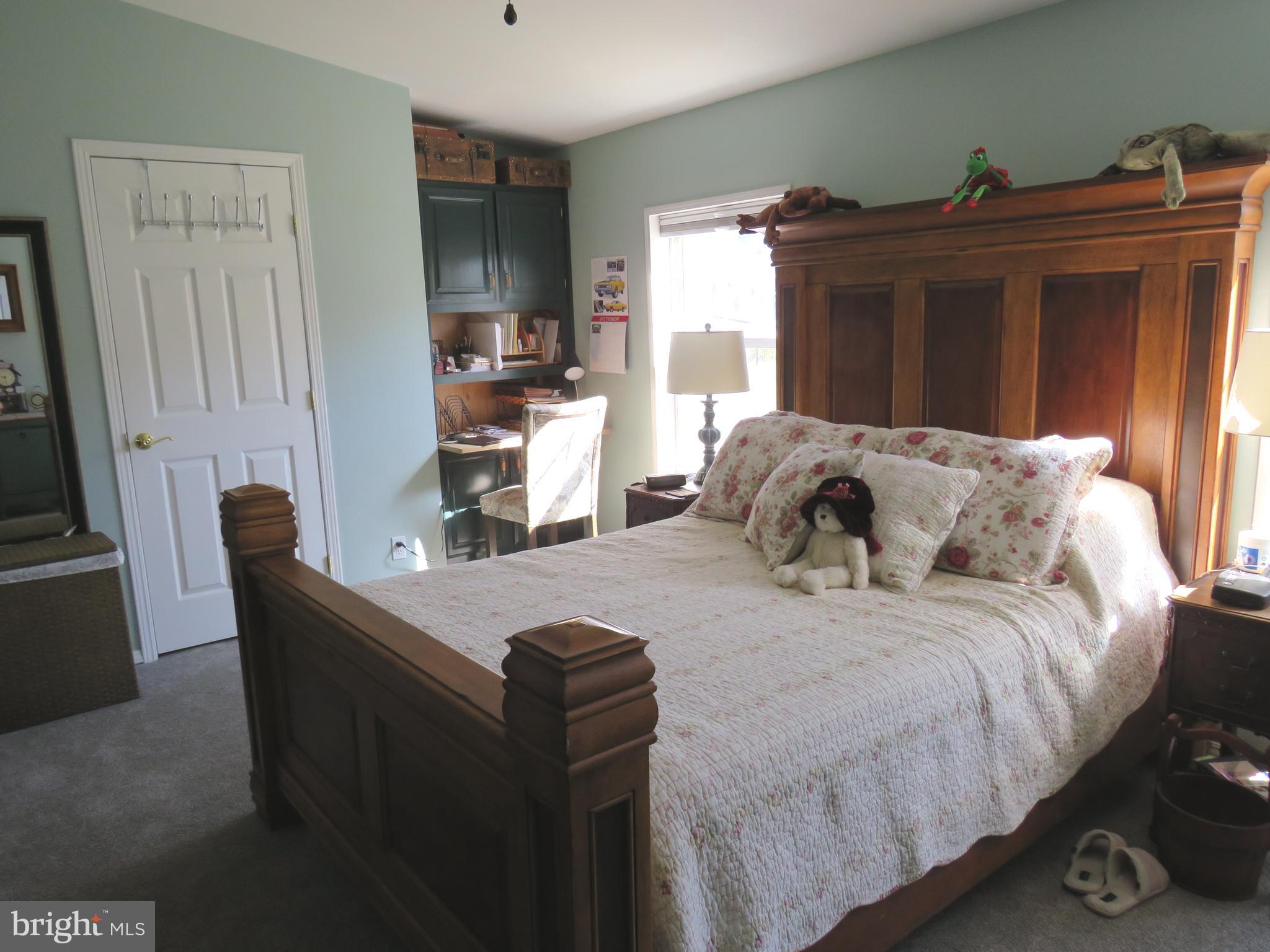 183 Spring Meadow Circle New Hope, PA 18938 - Photo 23 of 37 a bedroom with a bed and a window