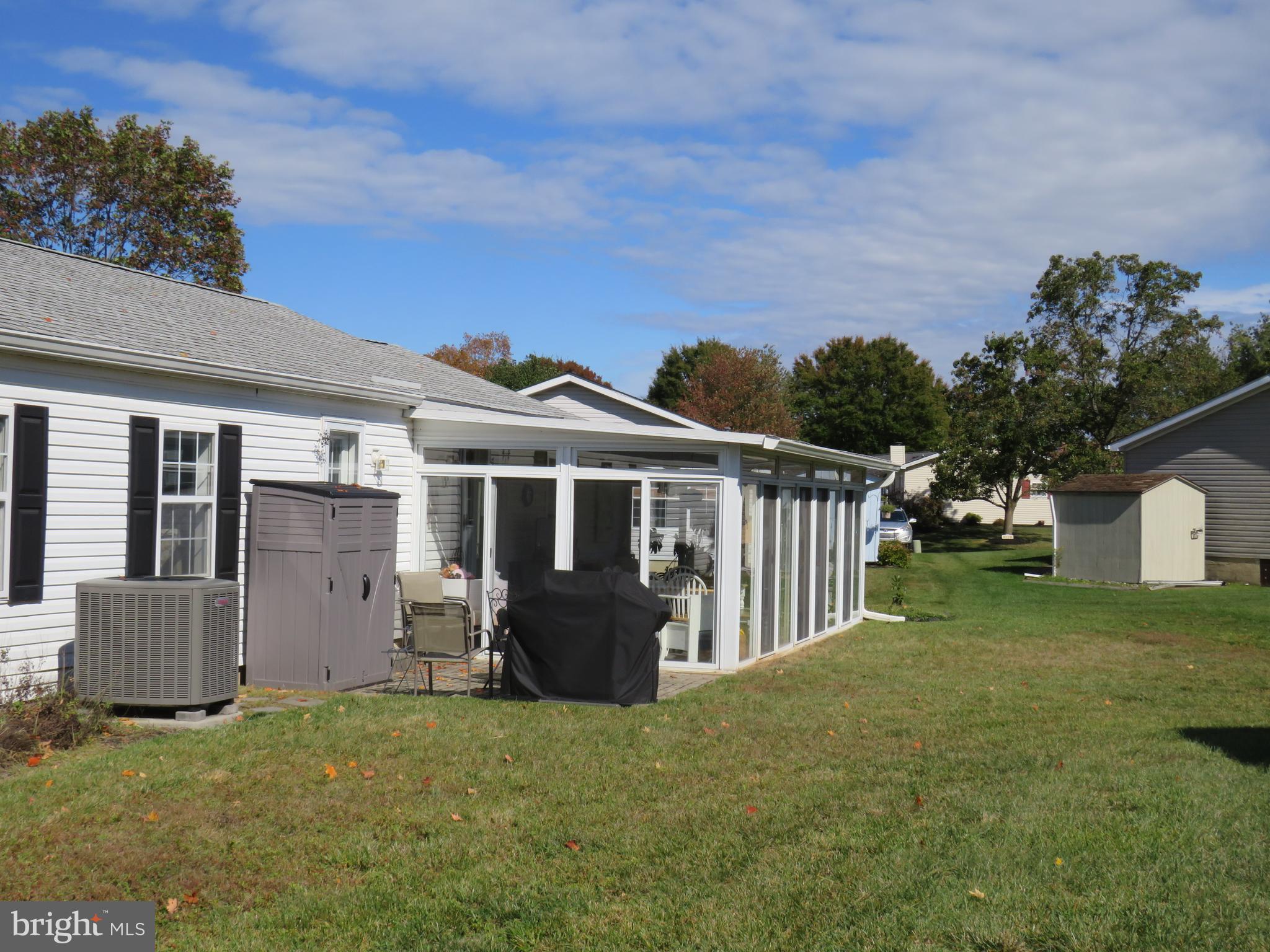183 Spring Meadow Circle New Hope, PA 18938 - Photo 36 of 37 a front view of house with yard and trees in the background