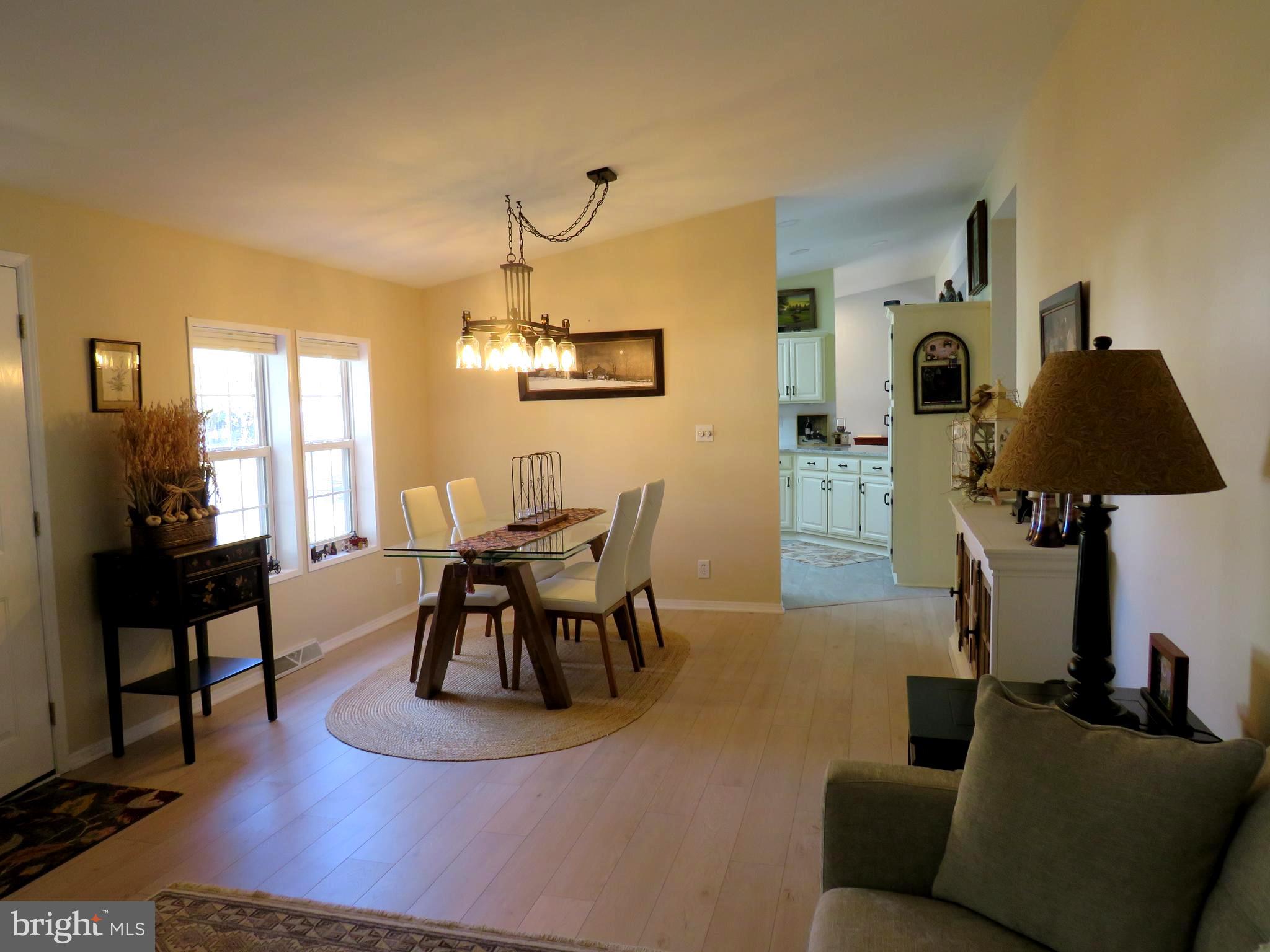 183 Spring Meadow Circle New Hope, PA 18938 - Photo 6 of 37 a living room with furniture and a wooden floor