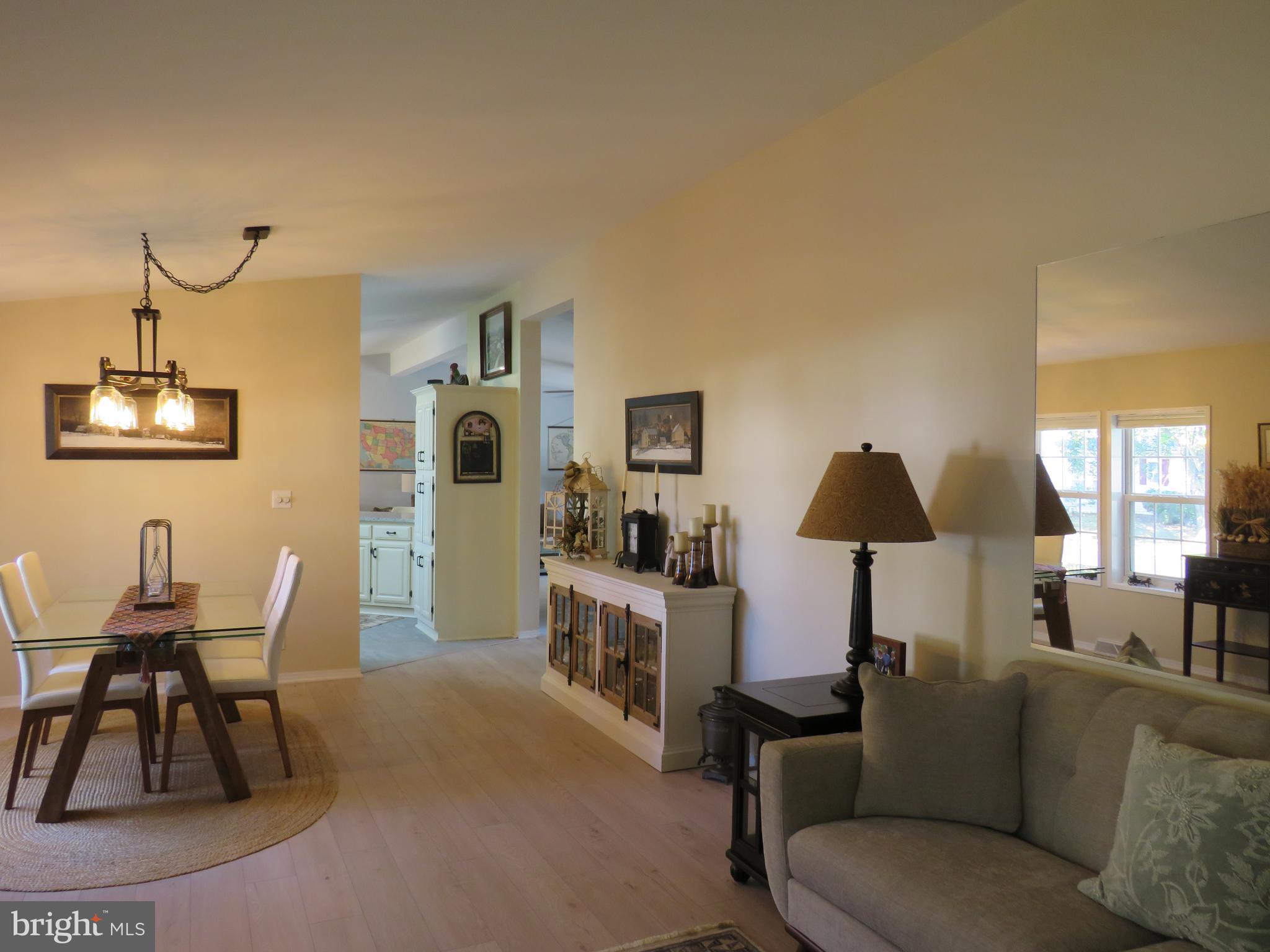 183 Spring Meadow Circle New Hope, PA 18938 - Photo 7 of 37 a living room with furniture and a lamp