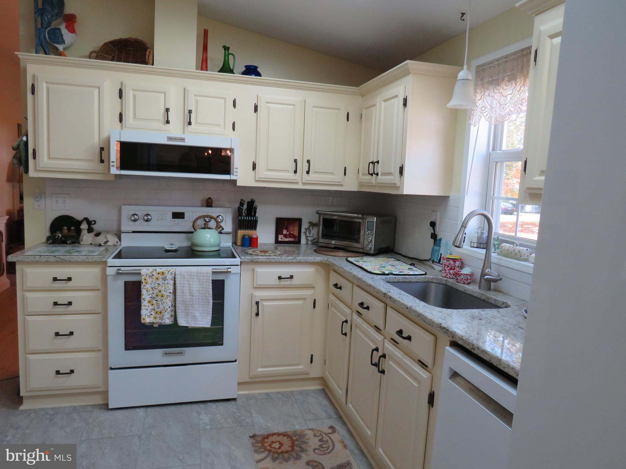 183 Spring Meadow Circle New Hope, PA 18938 - Photo 9 of 37 a kitchen with stainless steel appliances granite countertop a sink and cabinets