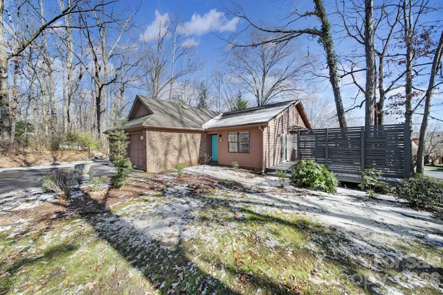 a front view of house with a garden