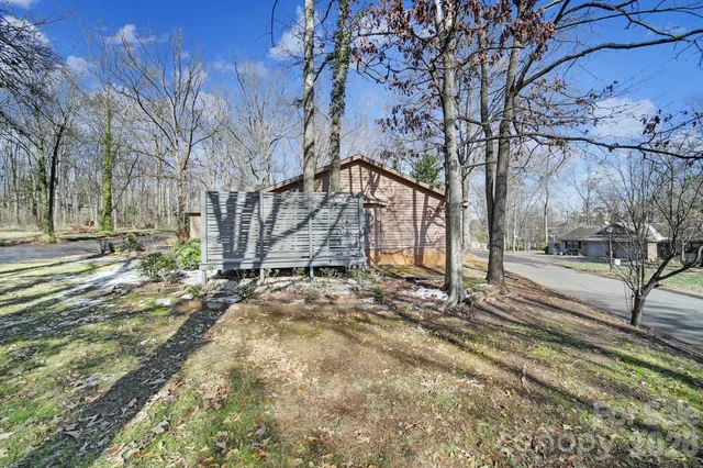 a view of a yard with snow on the road