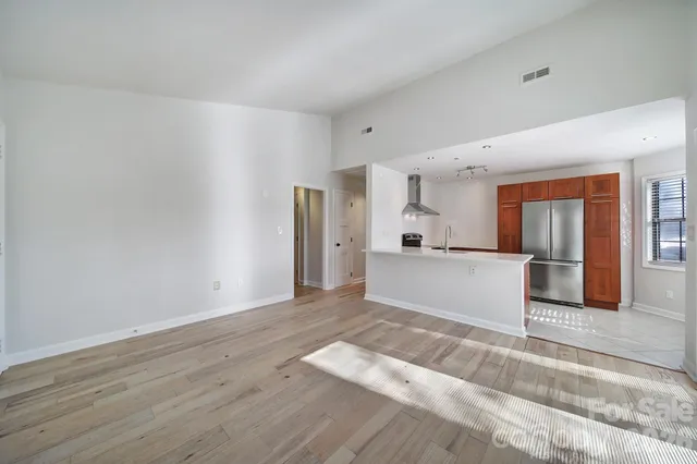 a view of kitchen with wooden floor