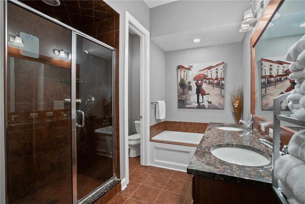 301 Fifth Avenue, Unit 511 Pittsburgh, PA 15222 - Photo 17 of 33 a bathroom with a sink and a mirror