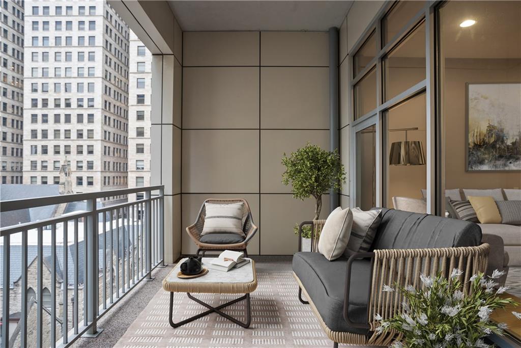 301 Fifth Avenue, Unit 511 Pittsburgh, PA 15222 - Photo 21 of 33 a living room with furniture and a potted plant