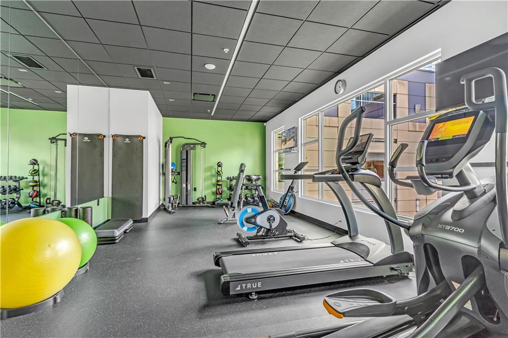 301 Fifth Avenue, Unit 511 Pittsburgh, PA 15222 - Photo 26 of 33 a living room with gym equipment