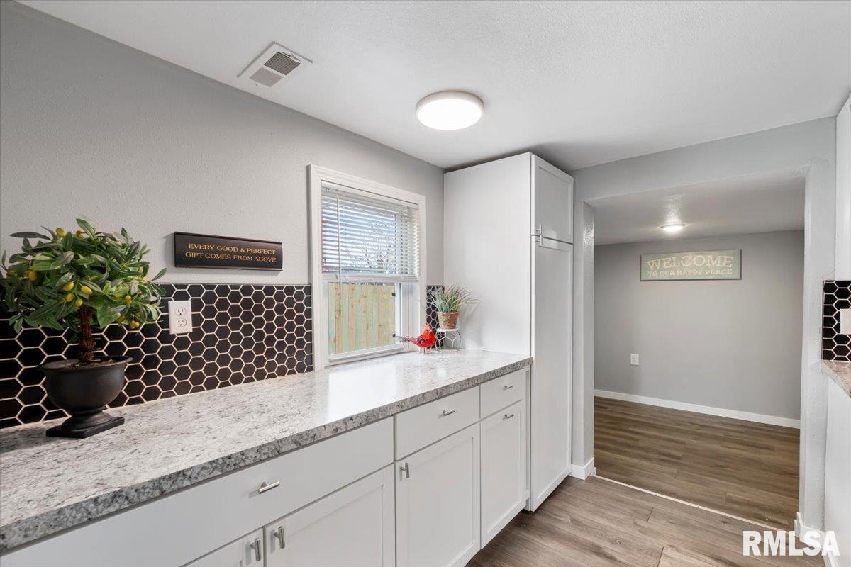 321 2nd Avenue East Milan, IL 61264 - Photo 12 of 33 a bathroom with a sink and a mirror