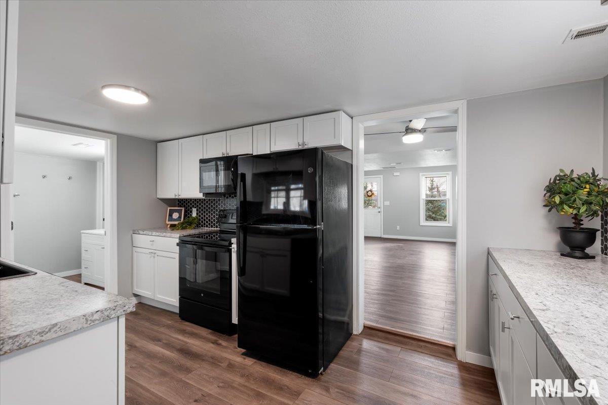 321 2nd Avenue East Milan, IL 61264 - Photo 13 of 33 a kitchen with a refrigerator and a sink