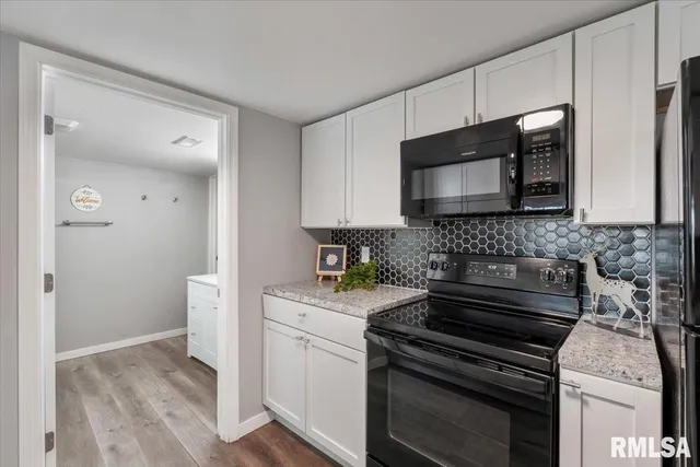 a kitchen with a sink stove and refrigerator