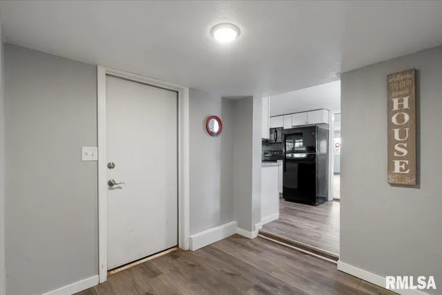 a bathroom with a sink vanity and a mirror