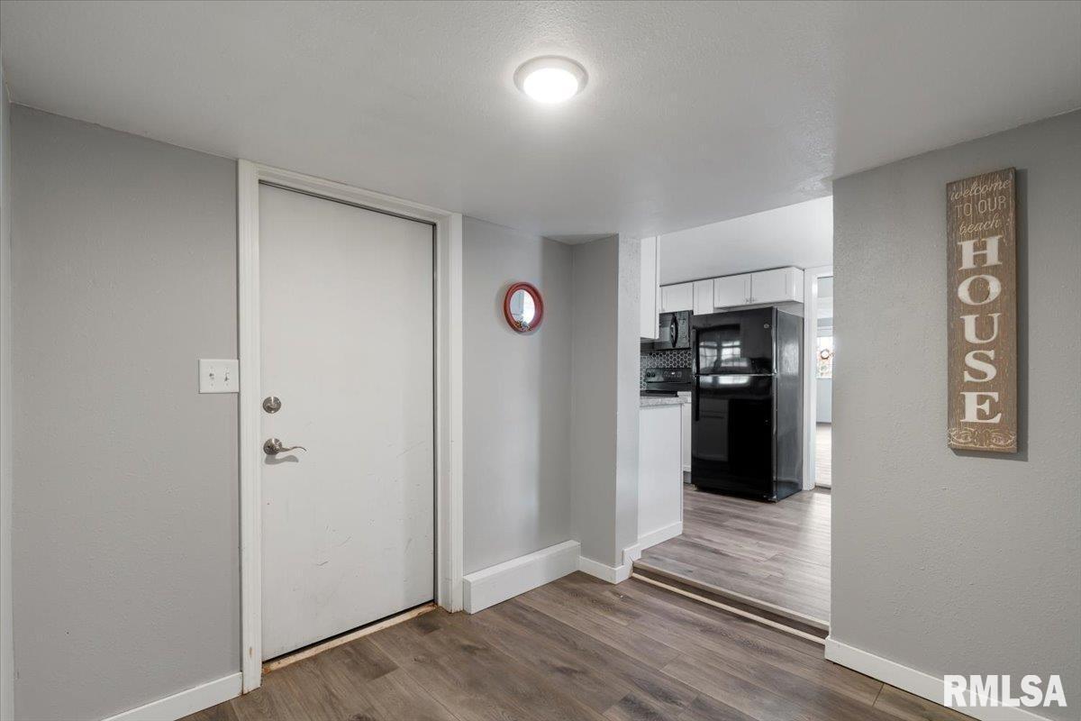 321 2nd Avenue East Milan, IL 61264 - Photo 18 of 33 a view of a kitchen with refrigerator and an oven