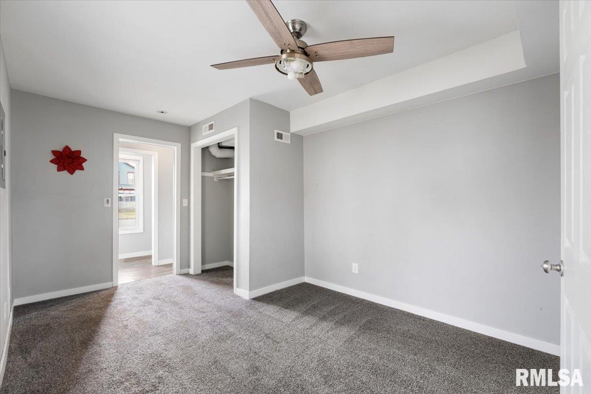 321 2nd Avenue East Milan, IL 61264 - Photo 20 of 33 a view of an empty room with a ceiling fan