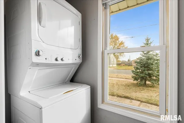 an empty room with a empty space and windows