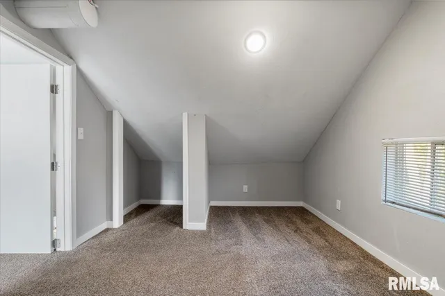a view of a livingroom with an empty space and a workspace