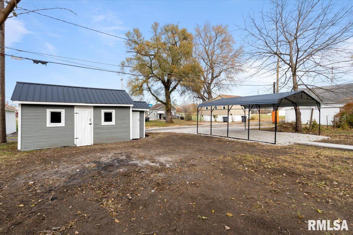 321 2nd Avenue East Milan, IL 61264 - Photo 29 of 33 a view of a house with a backyard