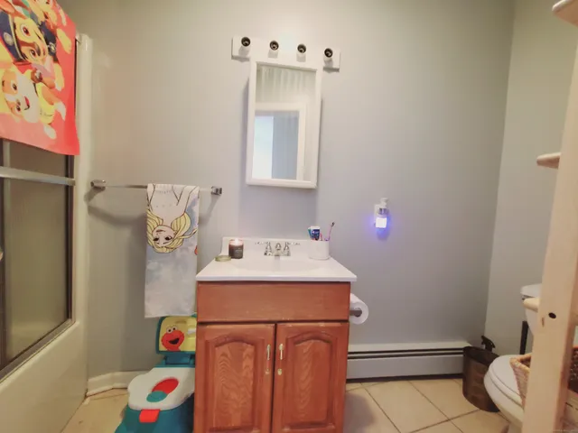 a utility room with a sink dryer and washer