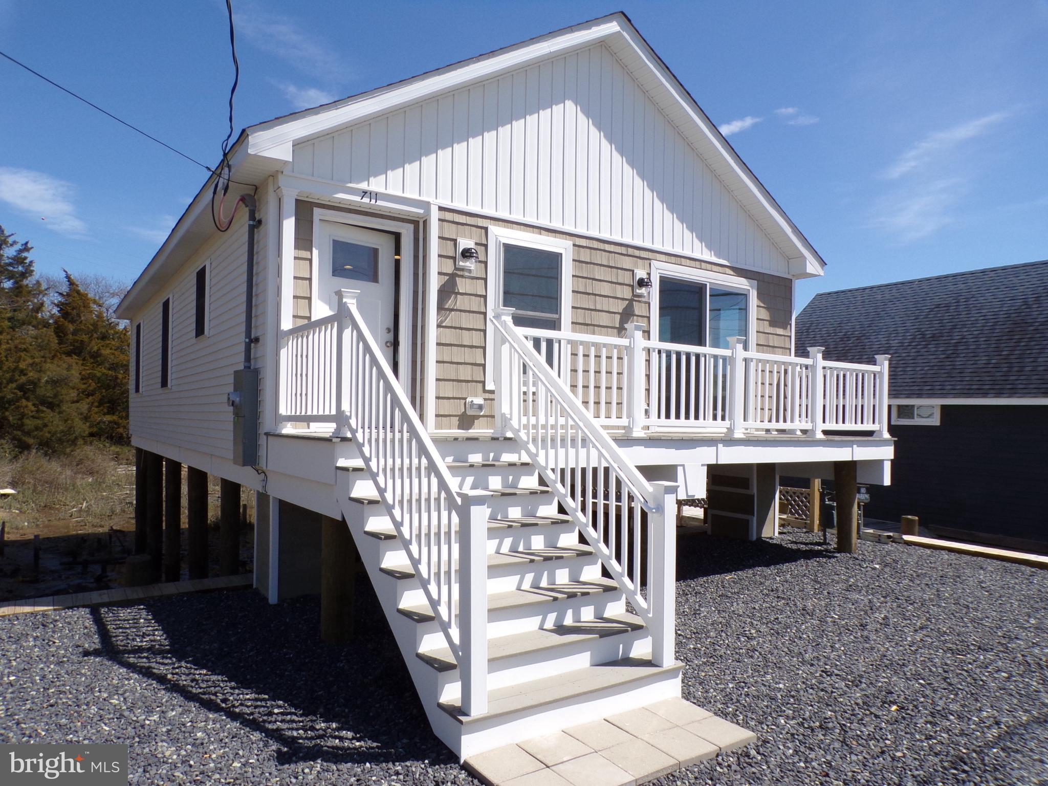 a front view of a house with deck and deck