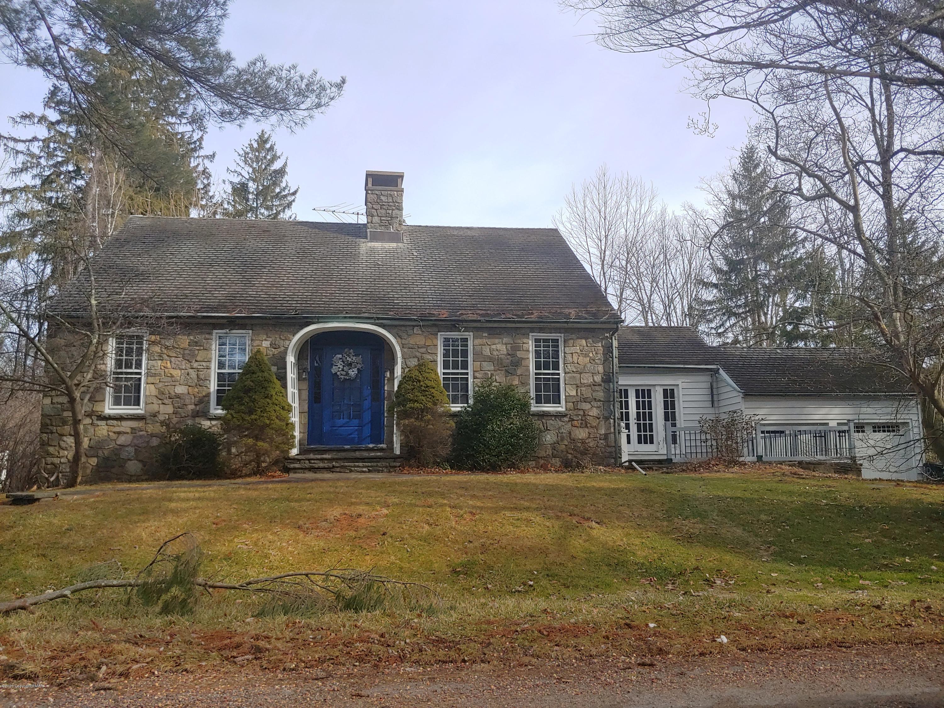 476 Laurel Pine Road Cresco, PA 18326 - Photo 1 of 45 a front view of a house with a yard