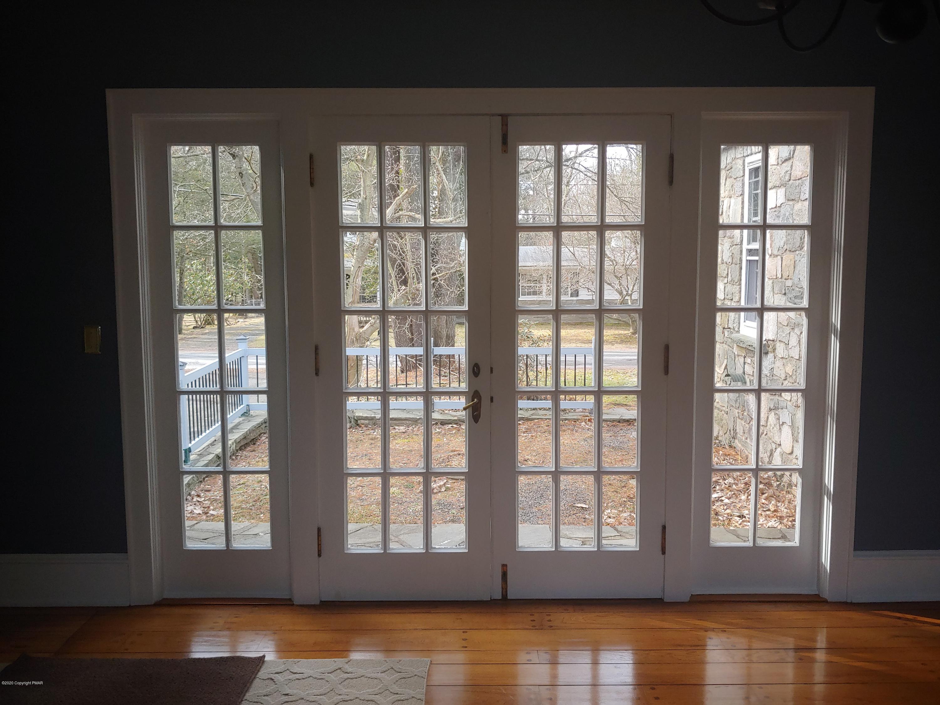 476 Laurel Pine Road Cresco, PA 18326 - Photo 11 of 45 a view of an empty room with wooden floor and a window
