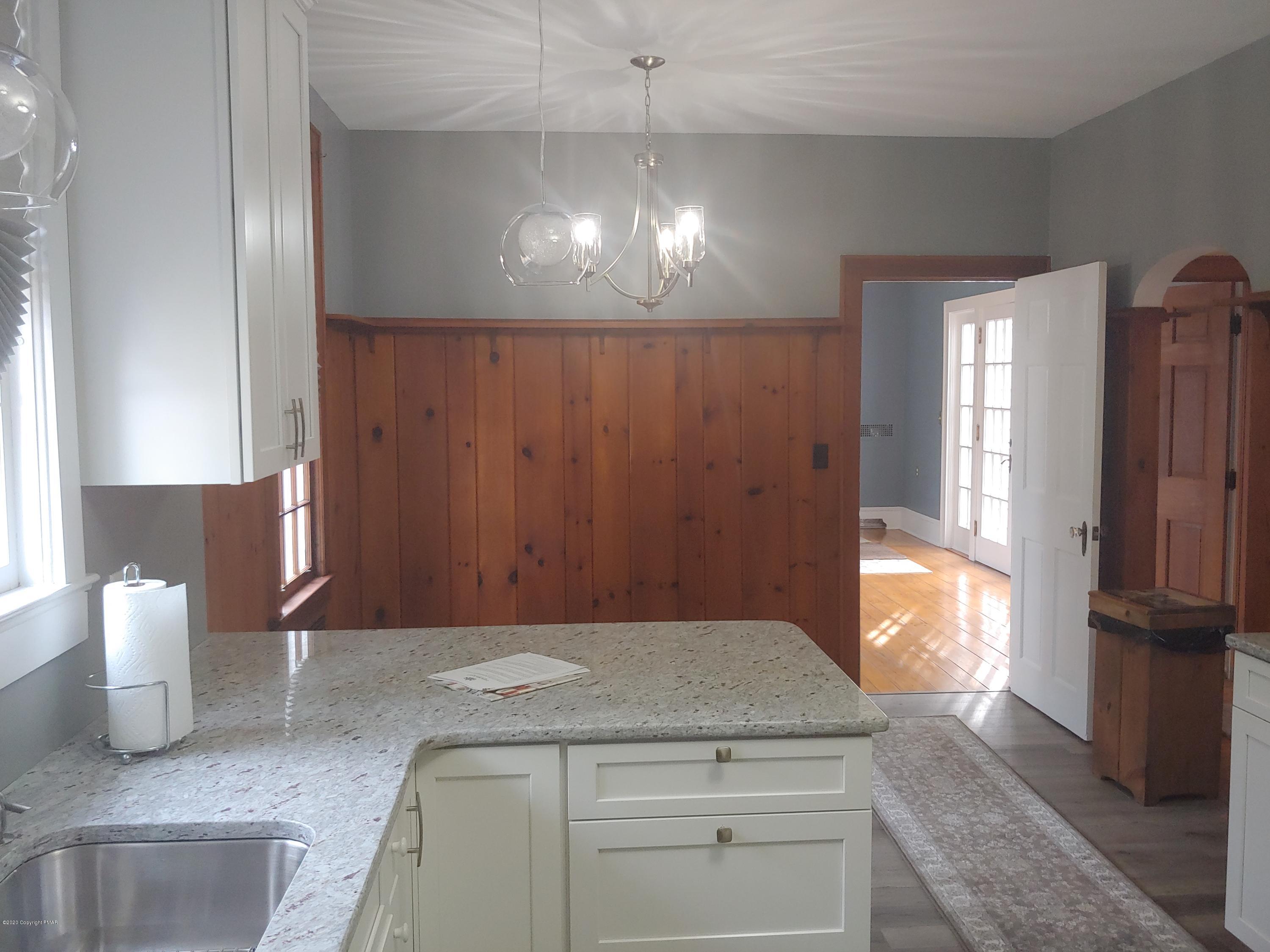 476 Laurel Pine Road Cresco, PA 18326 - Photo 17 of 45 a kitchen with a refrigerator and window
