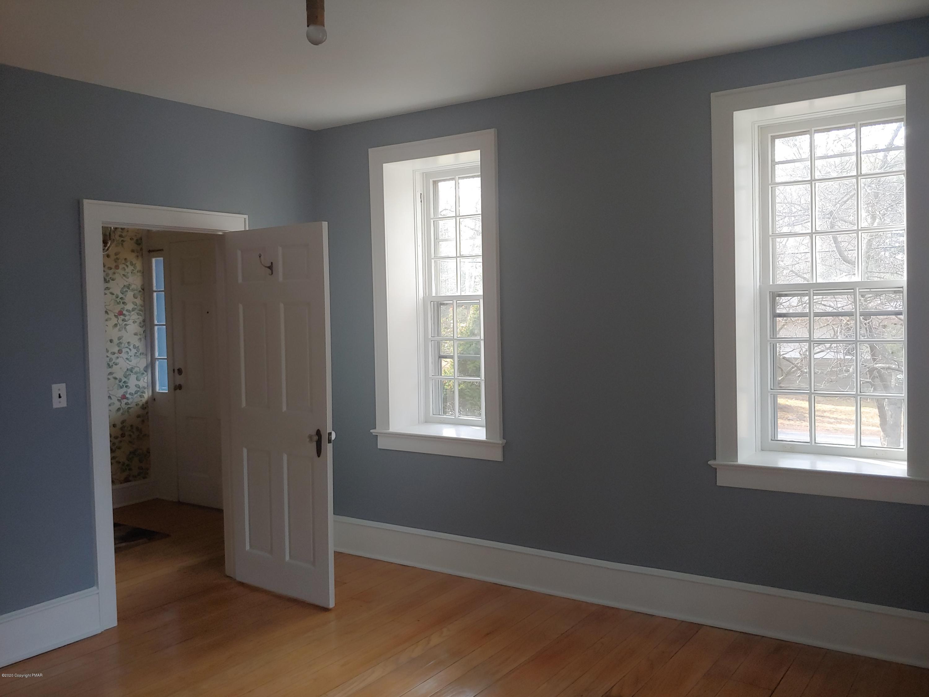 476 Laurel Pine Road Cresco, PA 18326 - Photo 21 of 45 a view of an empty room with wooden floor and a window