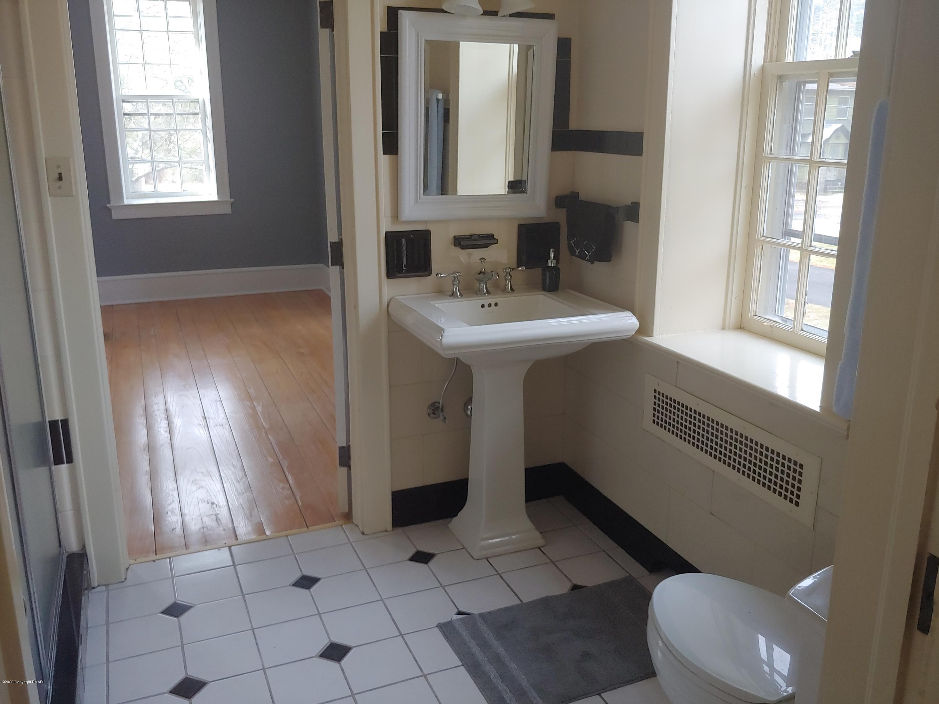 476 Laurel Pine Road Cresco, PA 18326 - Photo 27 of 45 a bathroom with a sink toilet and mirror