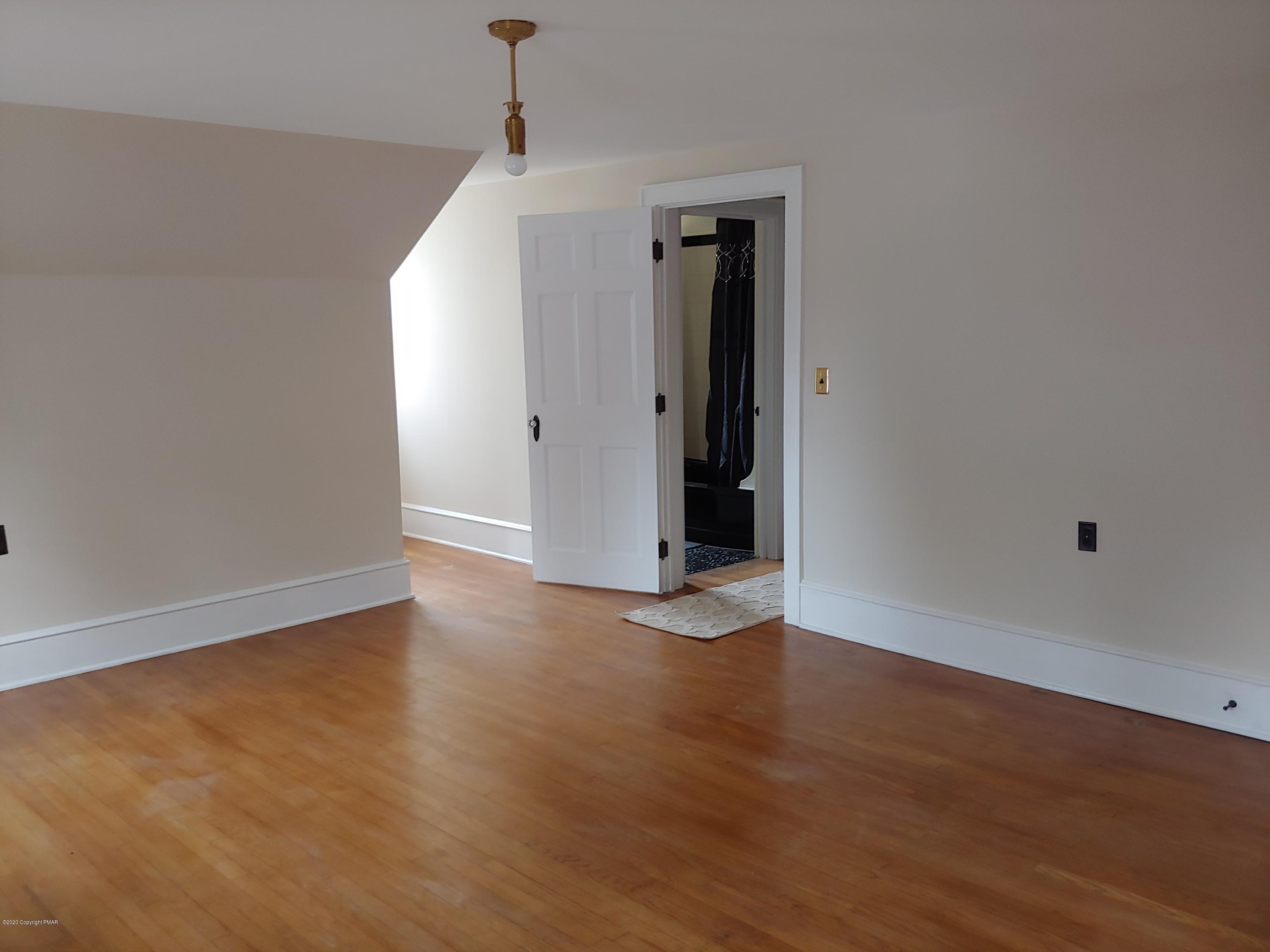 476 Laurel Pine Road Cresco, PA 18326 - Photo 29 of 45 a view of an empty room with wooden floor
