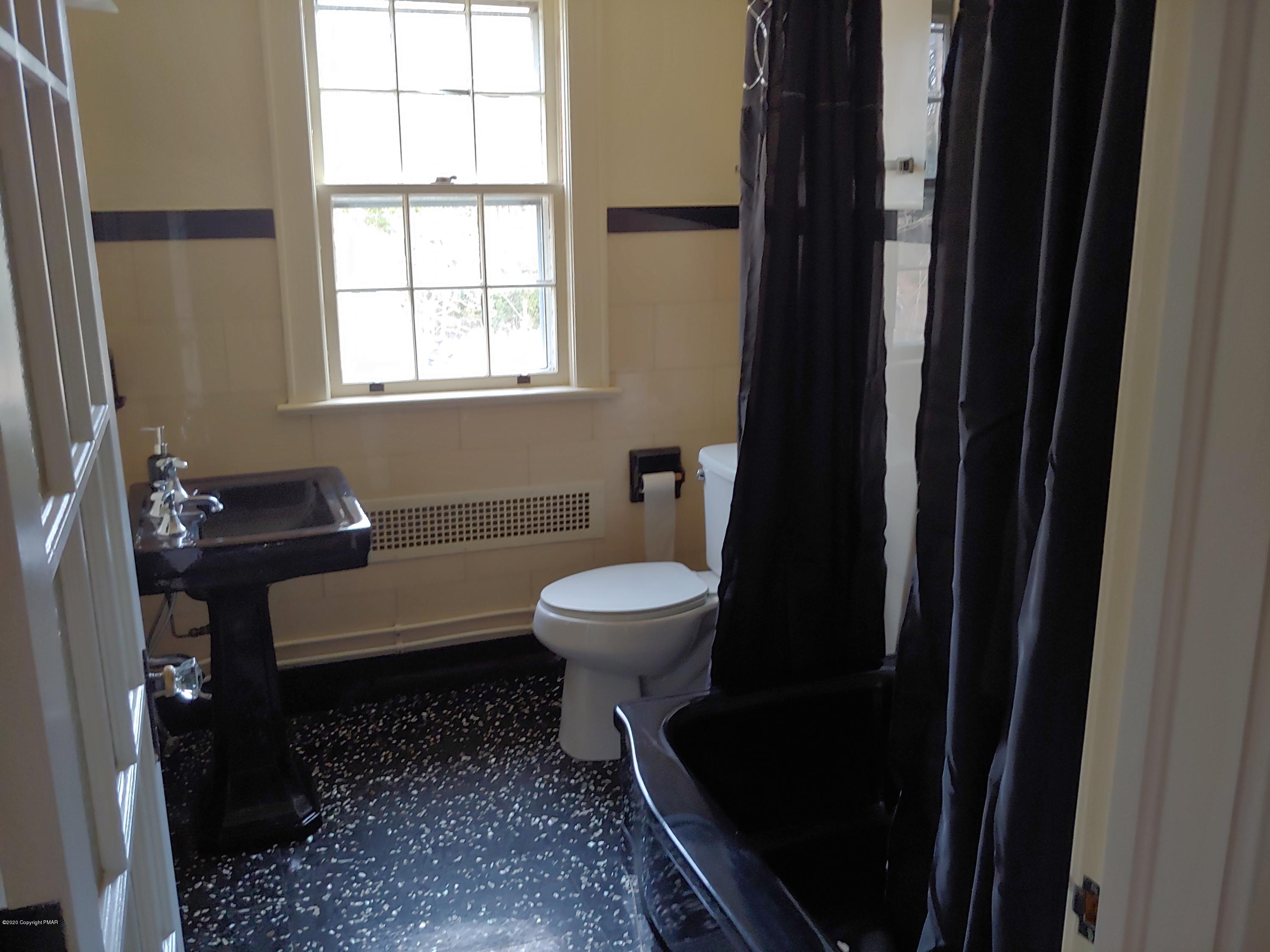 476 Laurel Pine Road Cresco, PA 18326 - Photo 35 of 45 a bathroom with a toilet a sink and a window