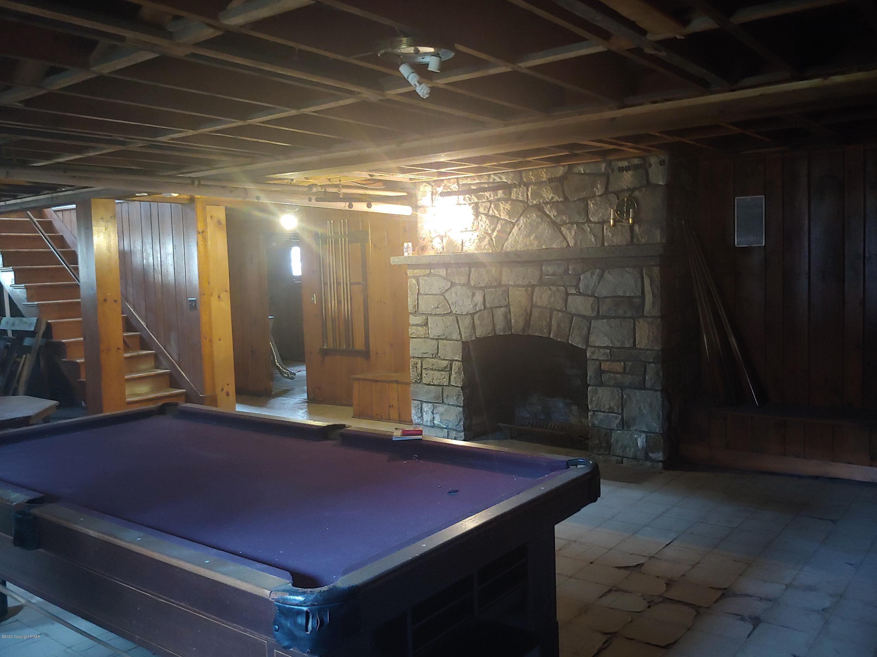 476 Laurel Pine Road Cresco, PA 18326 - Photo 37 of 45 a room with pool table and a fireplace
