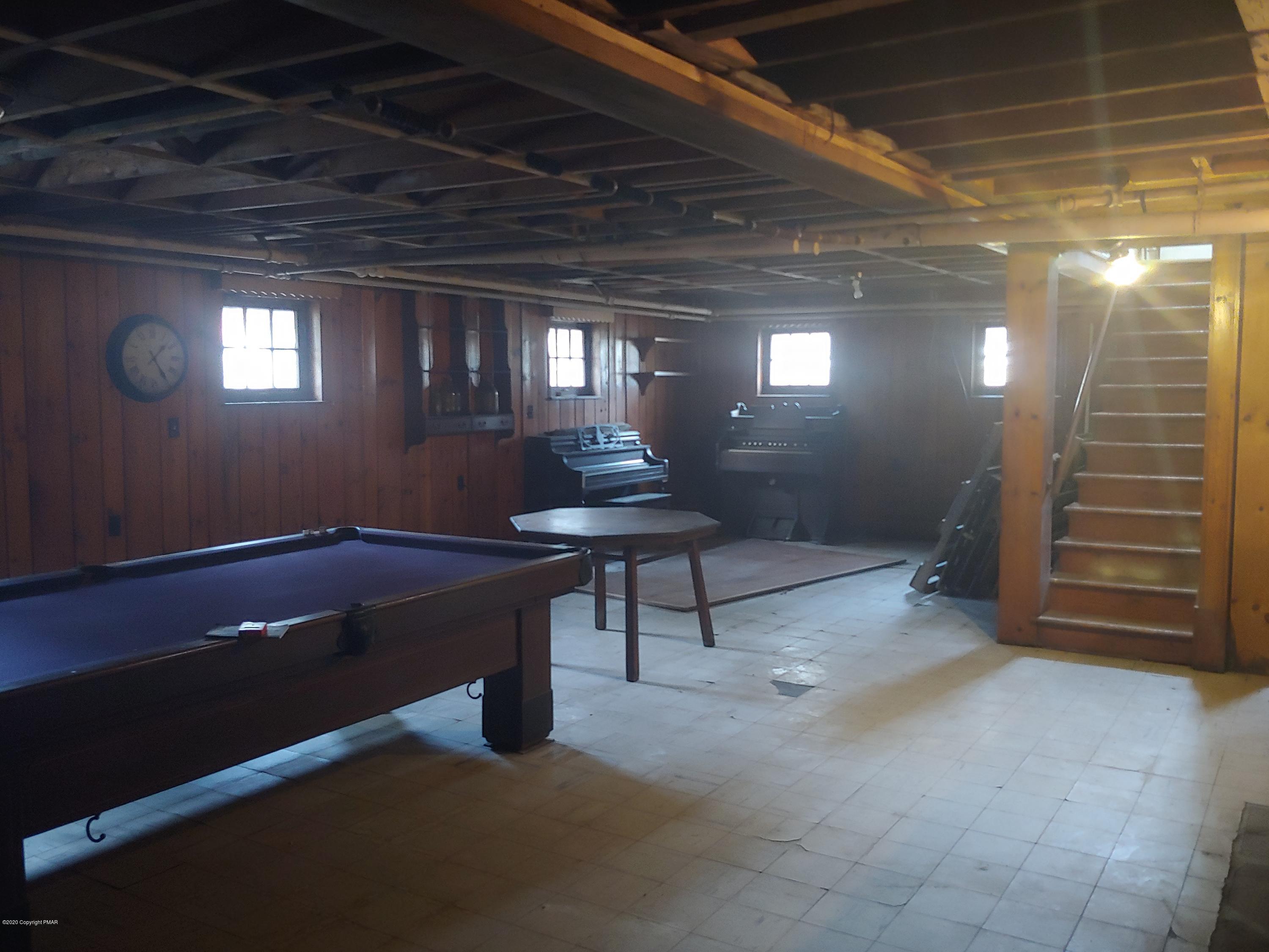 476 Laurel Pine Road Cresco, PA 18326 - Photo 39 of 45 a room with furniture and a chandelier
