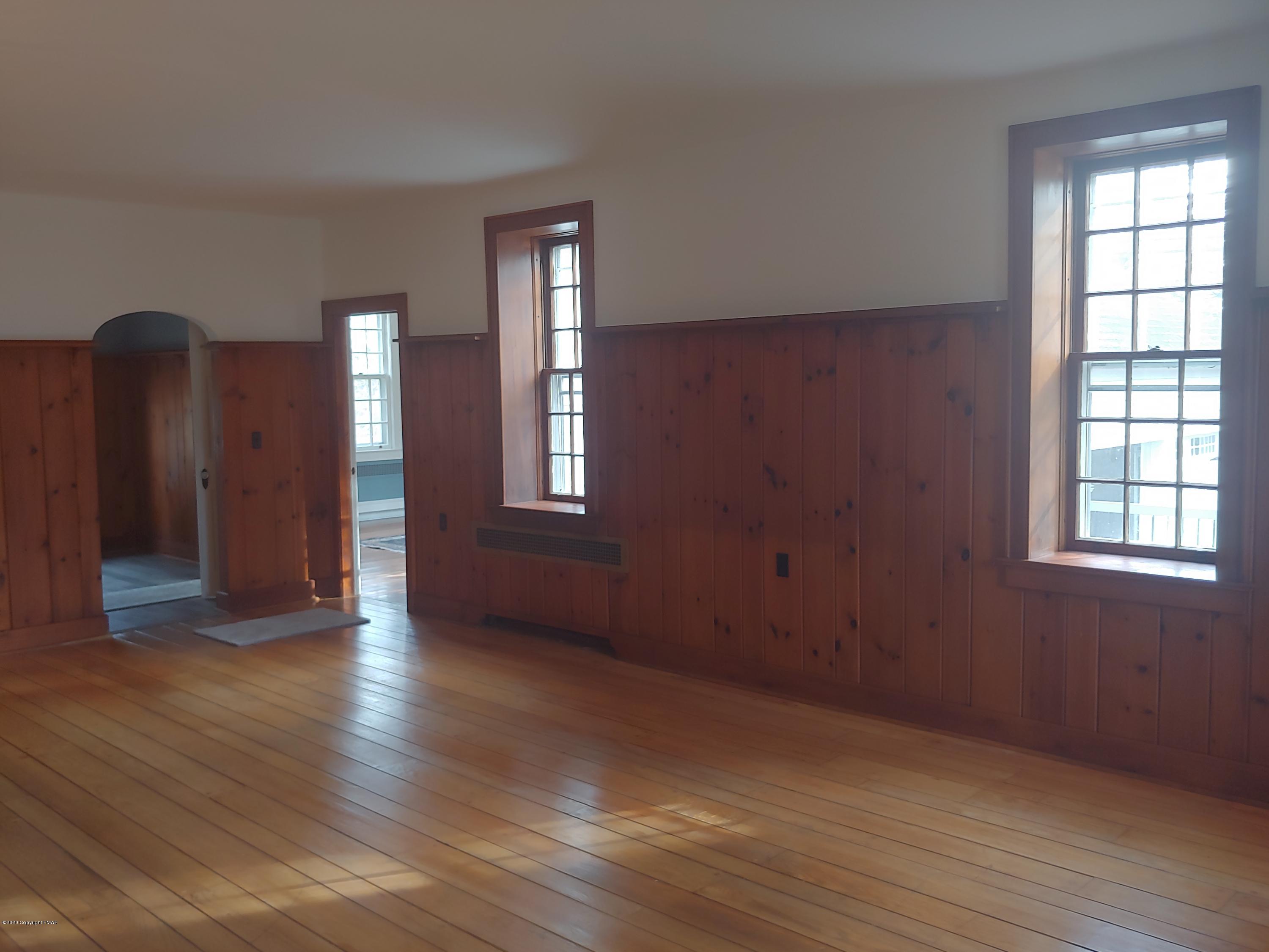 476 Laurel Pine Road Cresco, PA 18326 - Photo 4 of 45 a view of an empty room with wooden floor and a window