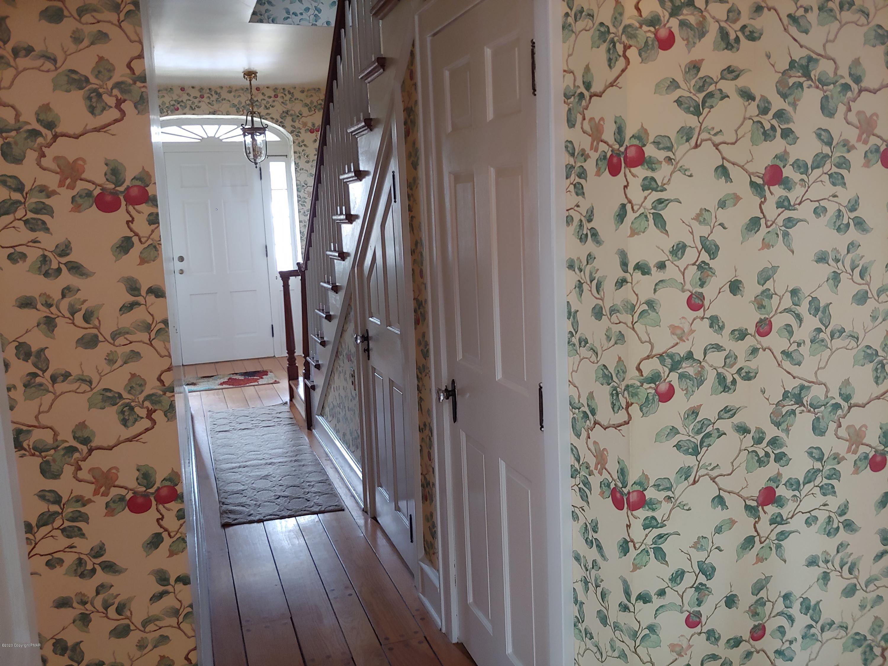 476 Laurel Pine Road Cresco, PA 18326 - Photo 41 of 45 a view of a hallway with wooden floor and front door