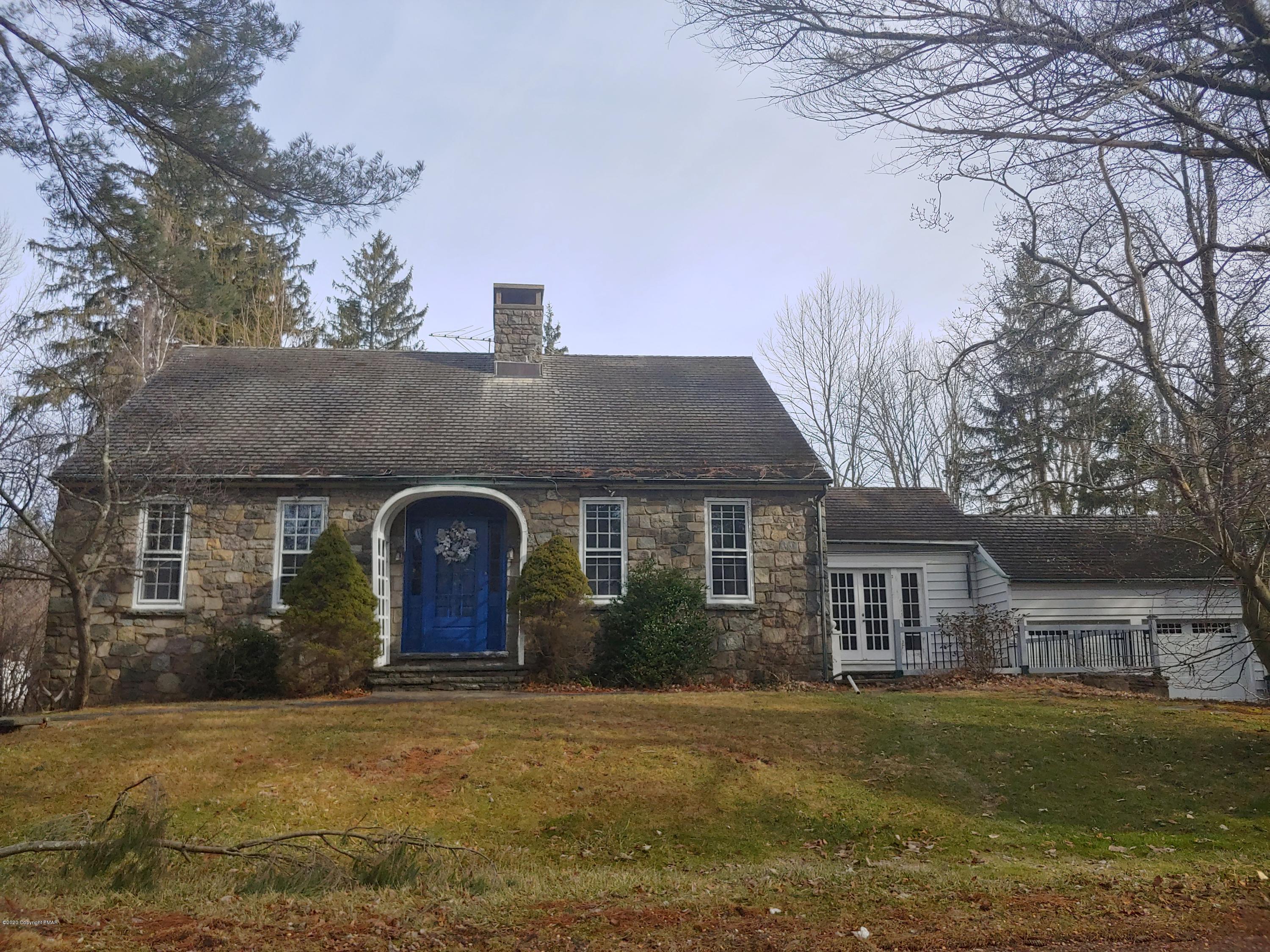 476 Laurel Pine Road Cresco, PA 18326 - Photo 44 of 45 a front view of a house with a garden and tree