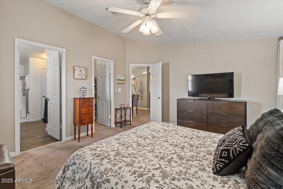 834 South Meridian Road, Unit 54 Apache Junction, AZ 85120 - Photo 26 of 56 a bedroom with a bed and a flat screen tv