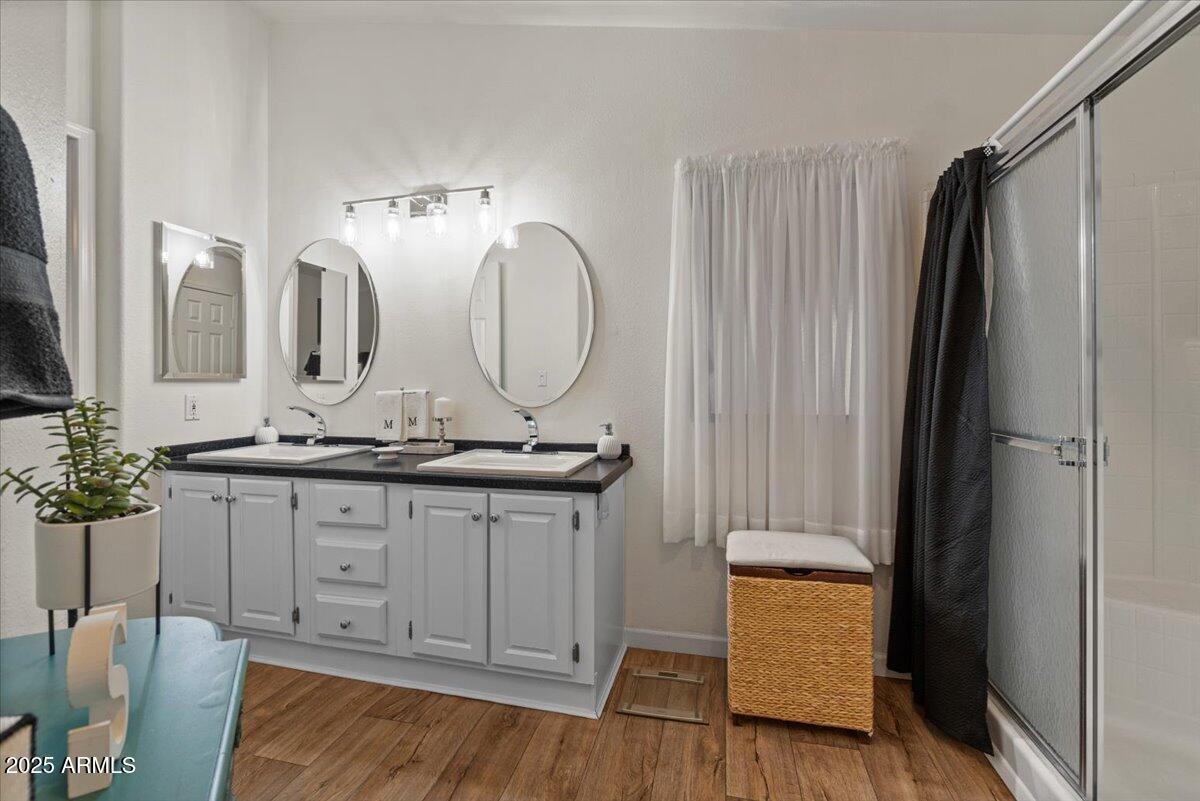 834 South Meridian Road, Unit 54 Apache Junction, AZ 85120 - Photo 28 of 56 a bathroom with double vanity sink and a mirror