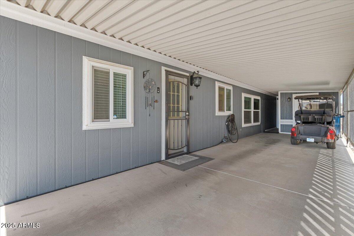 834 South Meridian Road, Unit 54 Apache Junction, AZ 85120 - Photo 34 of 56 33-Carport& Back door