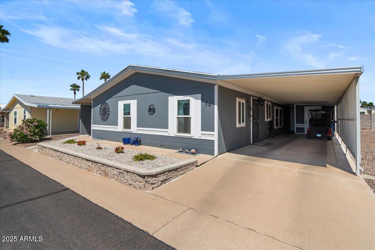 834 South Meridian Road, Unit 54 Apache Junction, AZ 85120 - Photo 3 of 56 a front view of a house with entertaining space