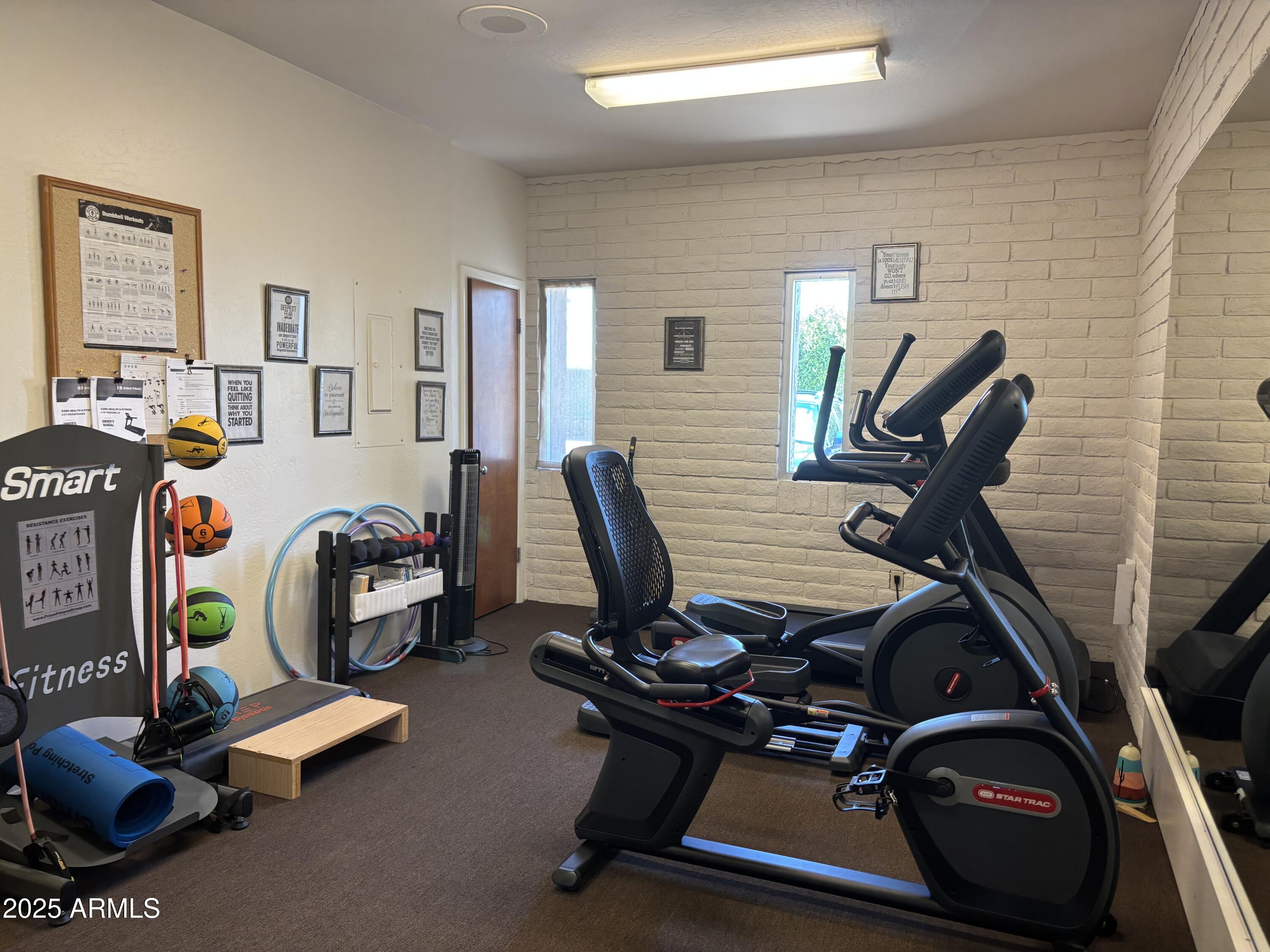 834 South Meridian Road, Unit 54 Apache Junction, AZ 85120 - Photo 49 of 56 a view of a room with gym equipment