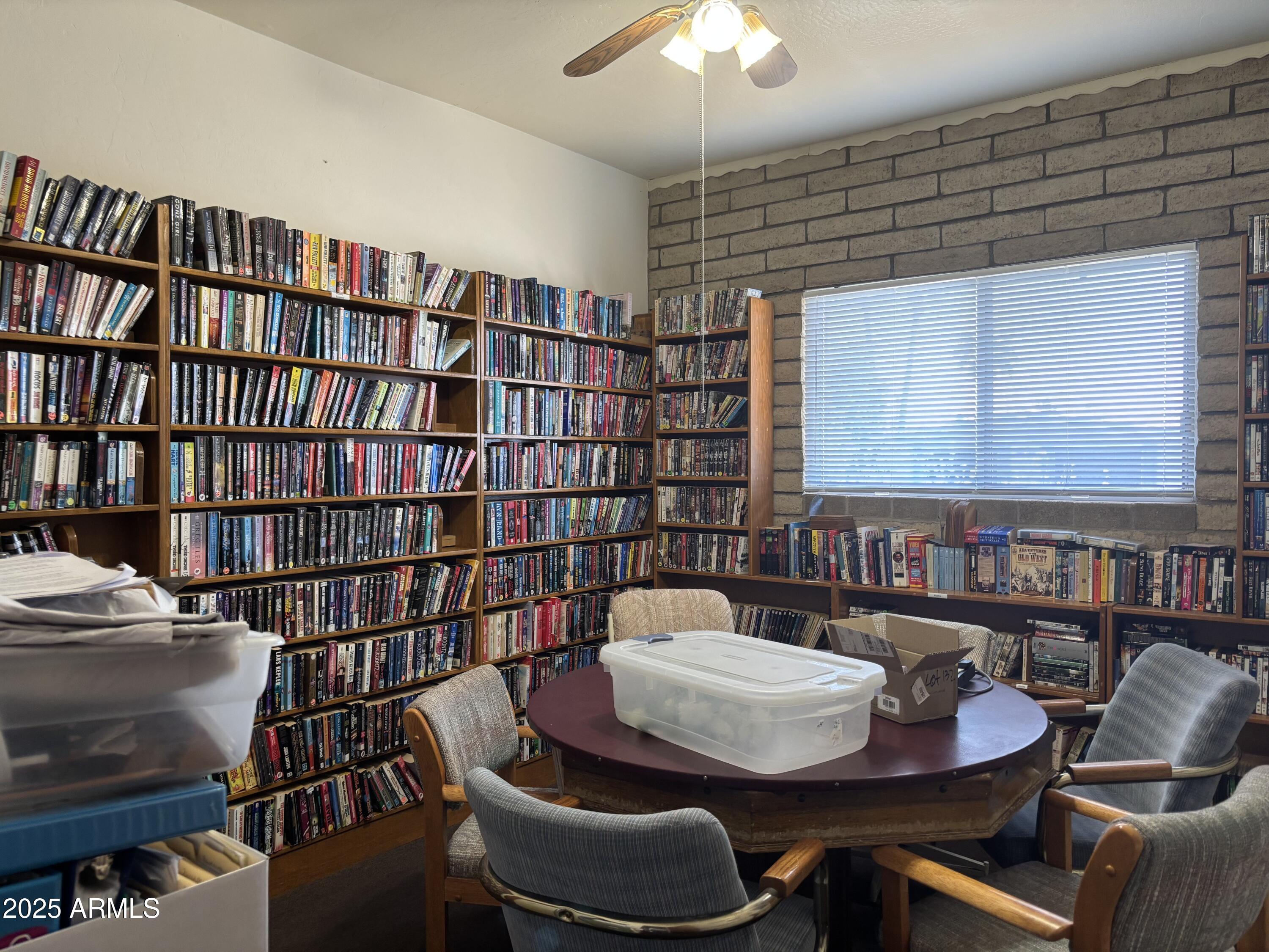 834 South Meridian Road, Unit 54 Apache Junction, AZ 85120 - Photo 50 of 56 a reading room with furniture and a book shelf