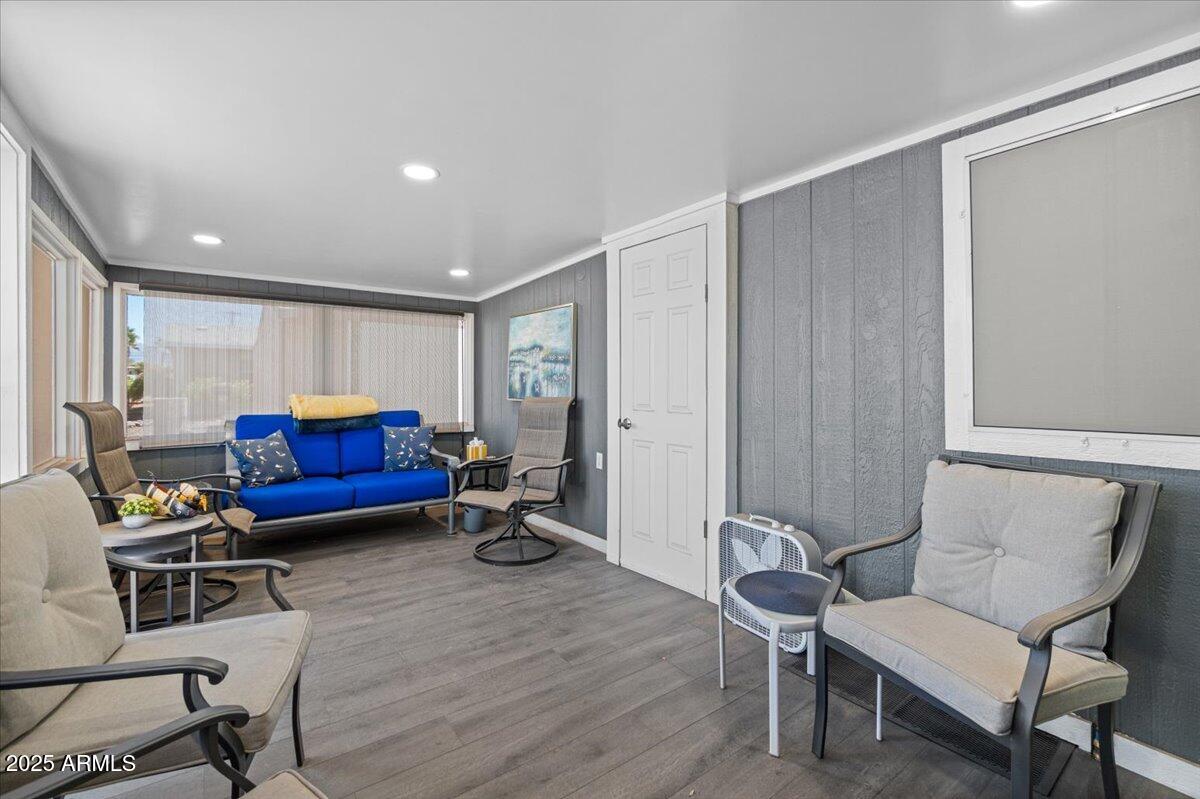 834 South Meridian Road, Unit 54 Apache Junction, AZ 85120 - Photo 7 of 56 a living room with furniture and a wooden floor