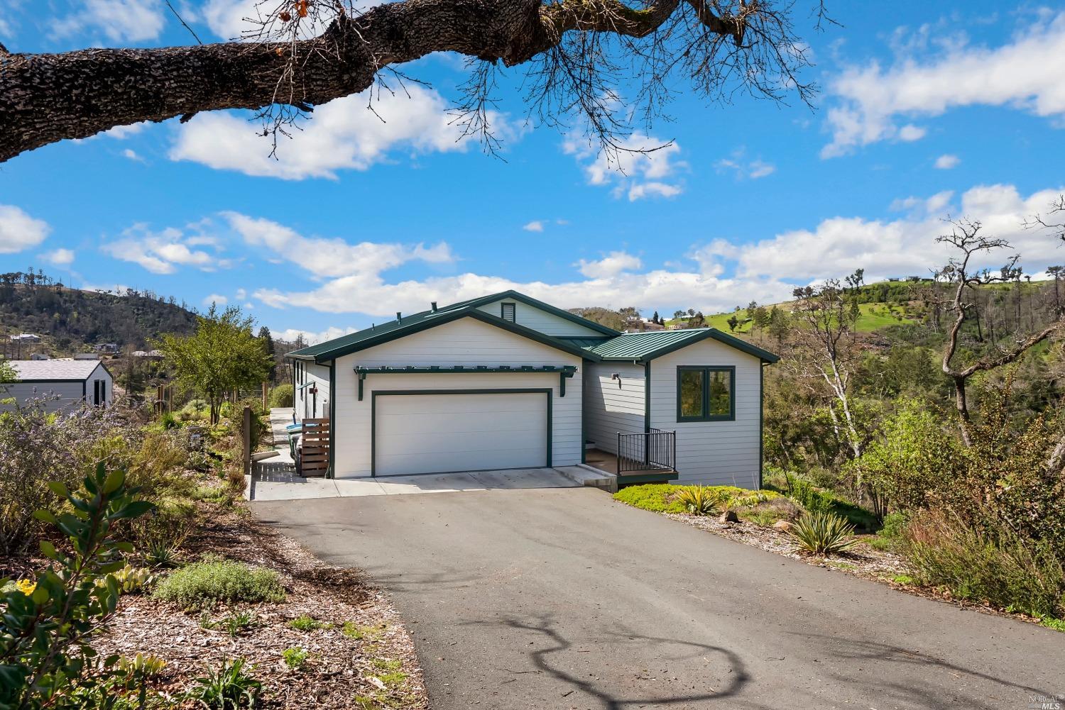 1288 Michele Way Santa Rosa, CA 95404 - Photo 1 of 25 a view of a house with a yard and large tree