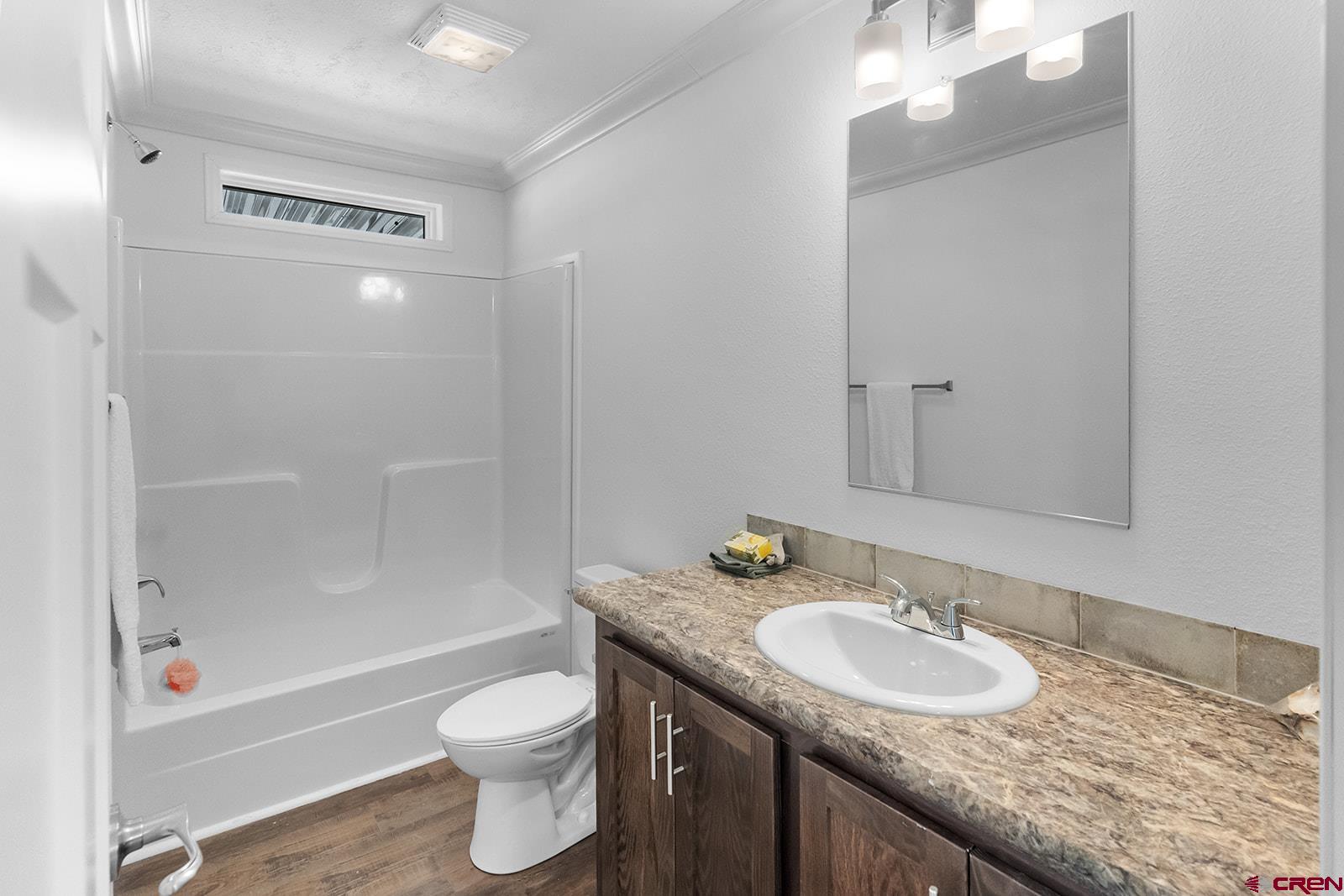 901 6530 Road, Unit 1504 Montrose, CO 81401 - Photo 11 of 25 a bathroom with a granite countertop sink toilet and shower